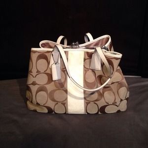 Tan and white coach handbag