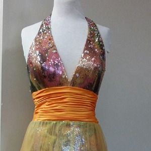 Halter top has a plunging neckline.