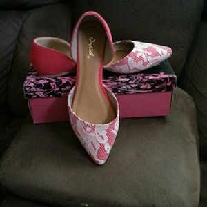 Red and lace pointed toe flats.