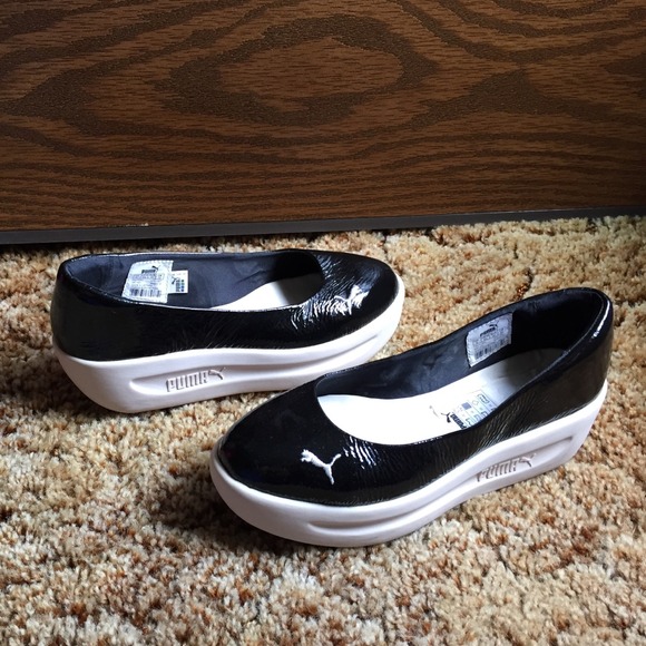 Puma black patent platform flats