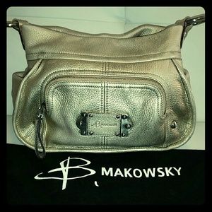 Athentic   B. Makowsky Gold purse with cover bag.