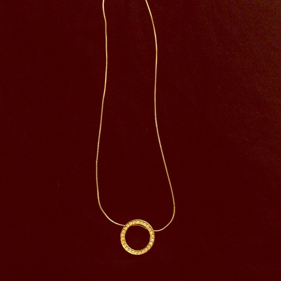 Gold necklace with a diamond circle pendant