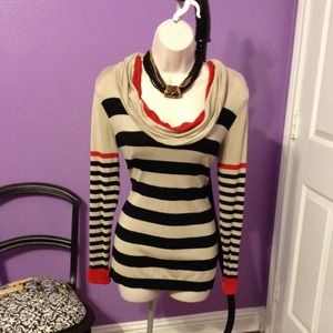 Love this sweater. Very flattering