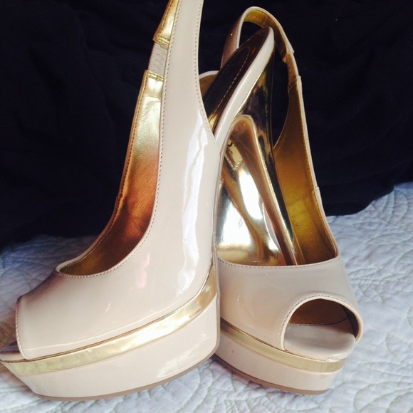 Nude guess peep toe sling backs with gold heel.