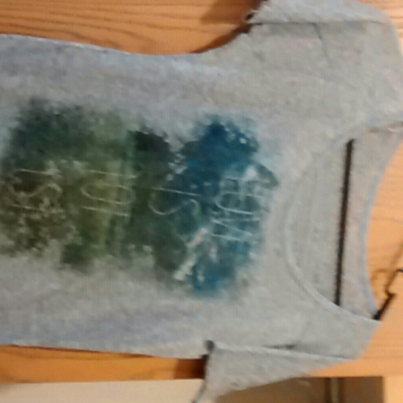 Over shirt. It says "love is not lost"