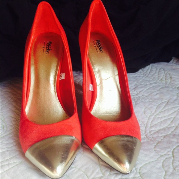 Red suede gold toe pumps
