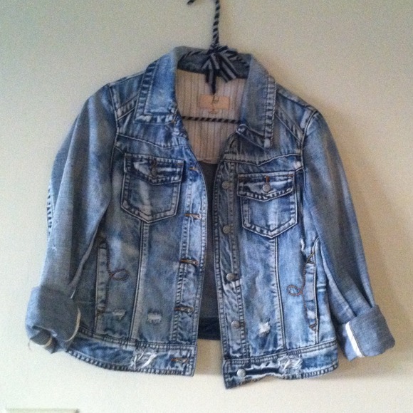 Distressed denim jacket