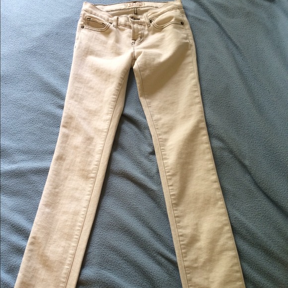 J Brand cream color skinny jeans.