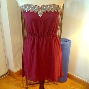 High low maroon dress with embellishments.