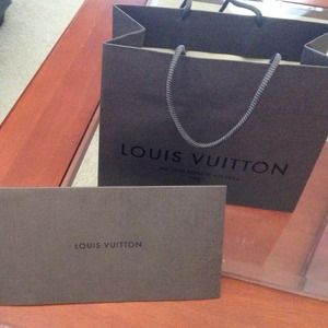 Louis Vuitton shopping bag and receipt card
