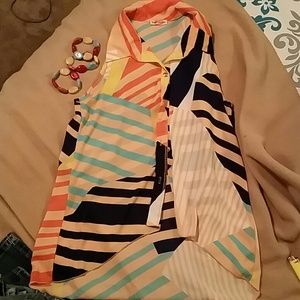 Long in.back button up sleeveless top with bracele