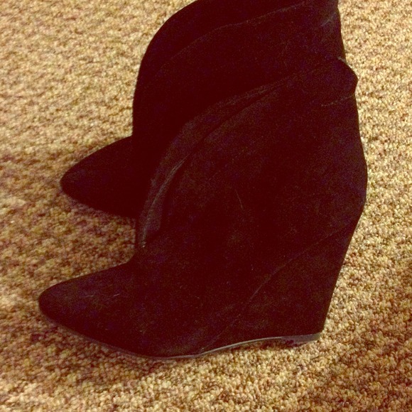 Steve Madden wedged boots.
