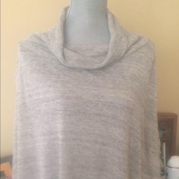 White gray cape sweater with cowl neck.