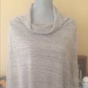 White gray cape sweater with cowl neck.