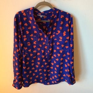 Blue blouse with orange hearts.