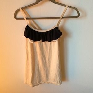 Nude top with black and white crochet flap