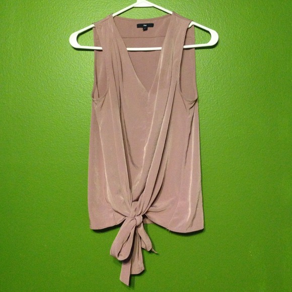 Gap top. Material is silk. A pearl like color.