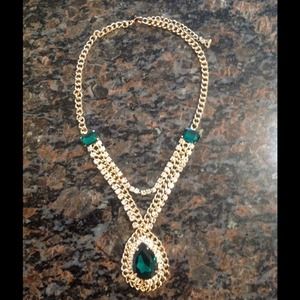 Gold and emerald color teardrop chain necklace.