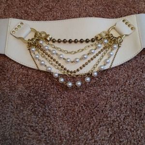 Wht BEBE belt with gold chains and pearls.
