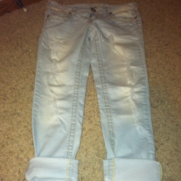 Light wash distressed skinny jeans