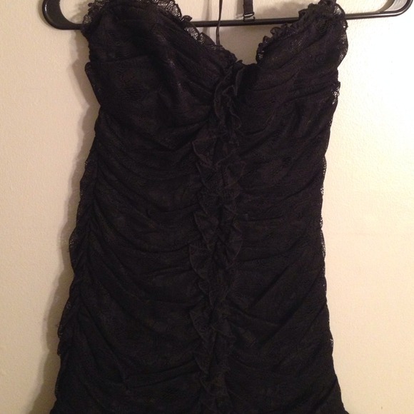 Sexy black strapless number from BEBE in a size M