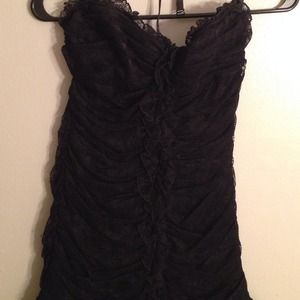 Sexy black strapless number from BEBE in a size M