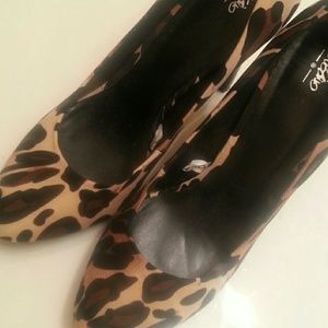 Leopard print pumps, worn indoors only