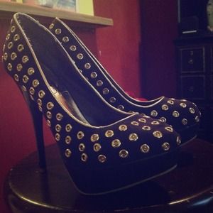 Purple studded heels.