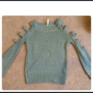 Never before worn slit armed sweater.