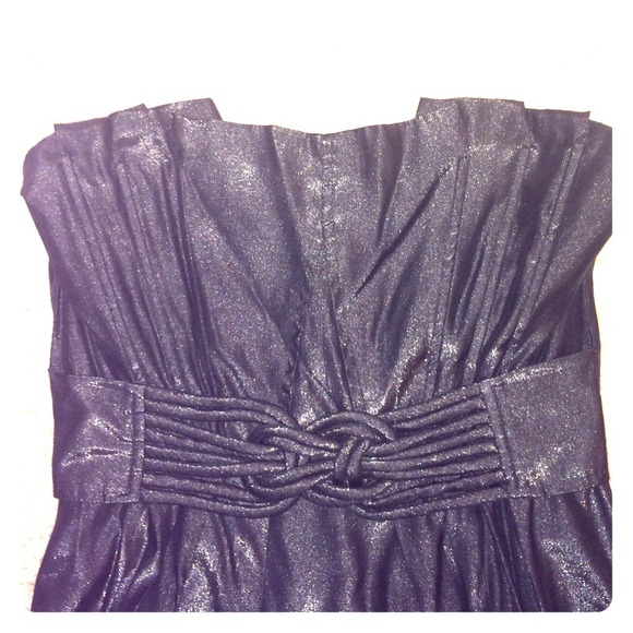 Black strapless dress with knot design.