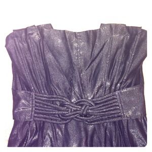 Black strapless dress with knot design.
