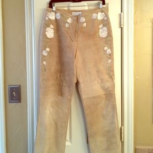 Tan suede pants with white embroidered roses