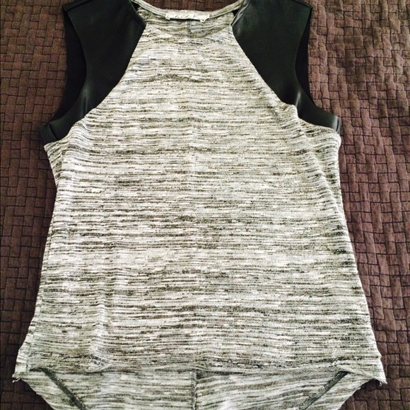 Beautiful shirt with faux leather sleeves.