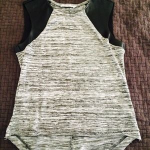 Beautiful shirt with faux leather sleeves.