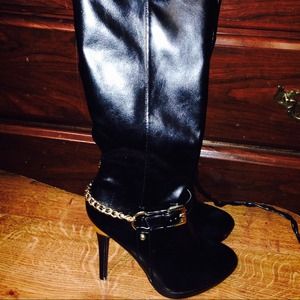 Black leather stiletto boots.