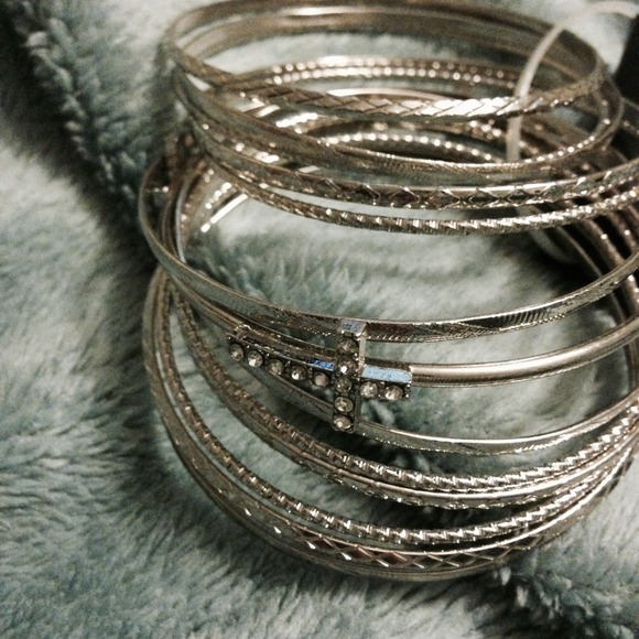 Silver bracelets-crosses on 1 of the bracelets
