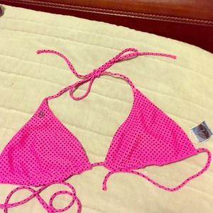Bright pink reversible black polka dot swim top