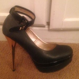 Black platform pumps with gold heel