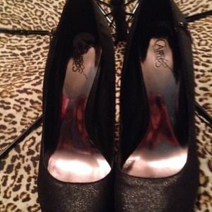 Carlos Santana black pums