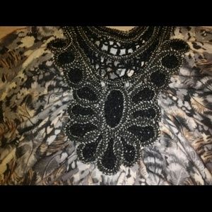 Embellished top with designs