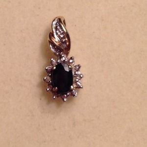 Sapphire pendant surrounded with small diamonds