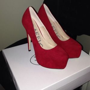 Red suede pumps