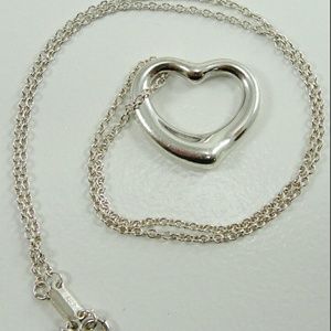 Tiffany and Co open heart necklace.