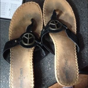 Moccasin flip flops with peace sign detail