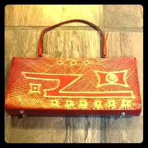 Red leather purse with gold design
