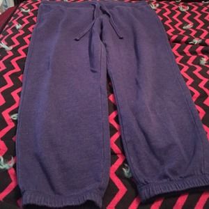 Purple sweatpants.
