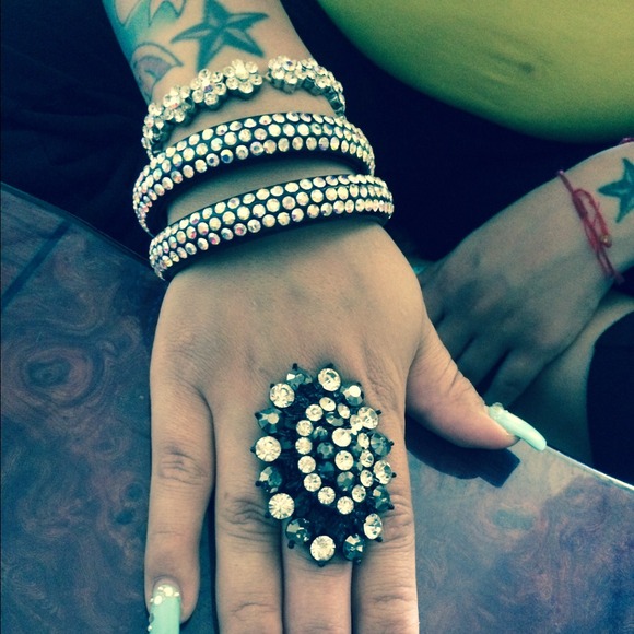 Ring and 2 blk braclets