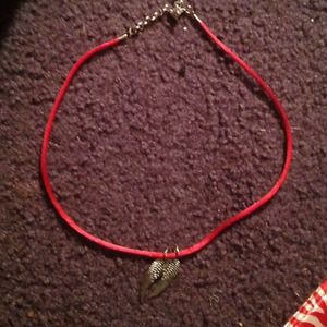 red cloth necklace with angel wings