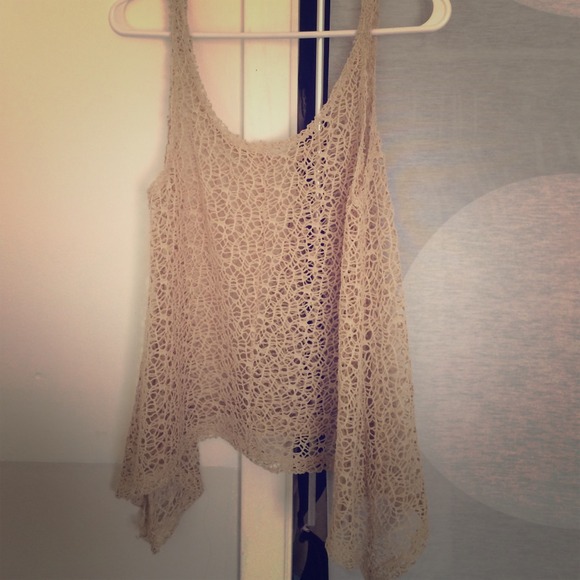 Sleeveless light brown top. See thru. Very cute.