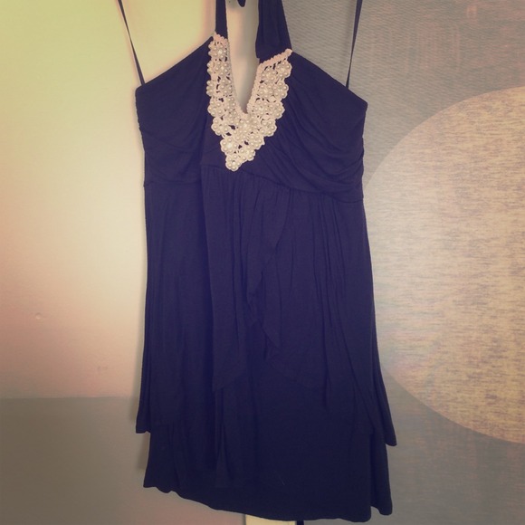 Navy blue top with pearl design v neck upper area